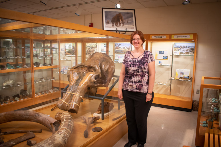 Sheila Swyrtek, Geology Professor and museum director with a columbian mammoth skull and tusks